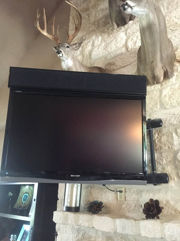 Wall-mounted TV installation above fireplace mantel — S&G Technologies